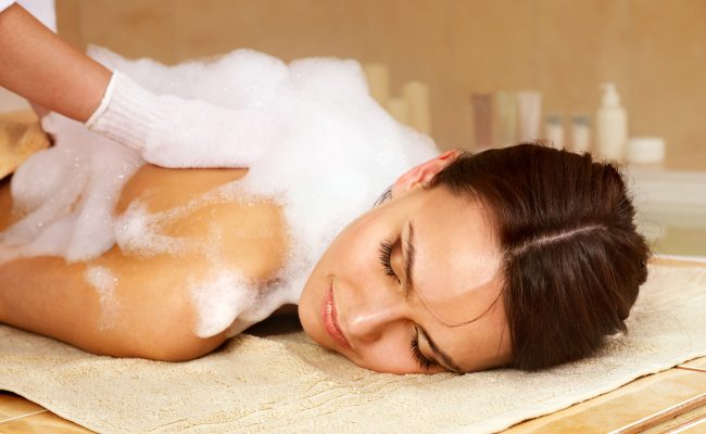 Massage of woman in beauty spa.